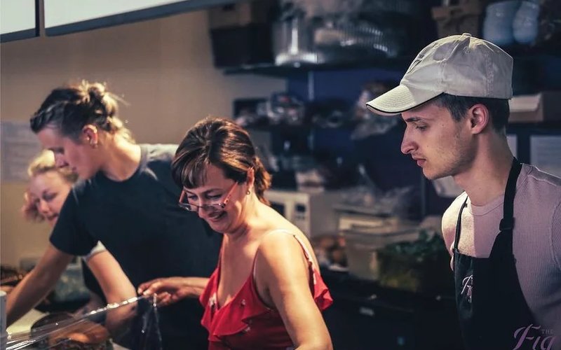 The Fig team preparing fresh made-in-house food behind the counter in downtown Vernon
