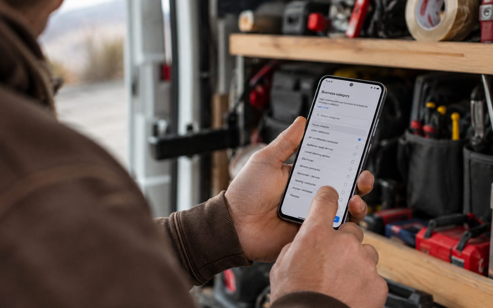 Okanagan tradesperson selecting the right Google Business Profile category on a phone